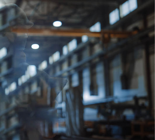 Professional Heavy Industry Engineer/Worker Wearing Safety Uniform and Hard Hat Uses Tablet Computer. Serious Successful Female Industrial Specialist Walking in a Metal Manufacture Warehouse.