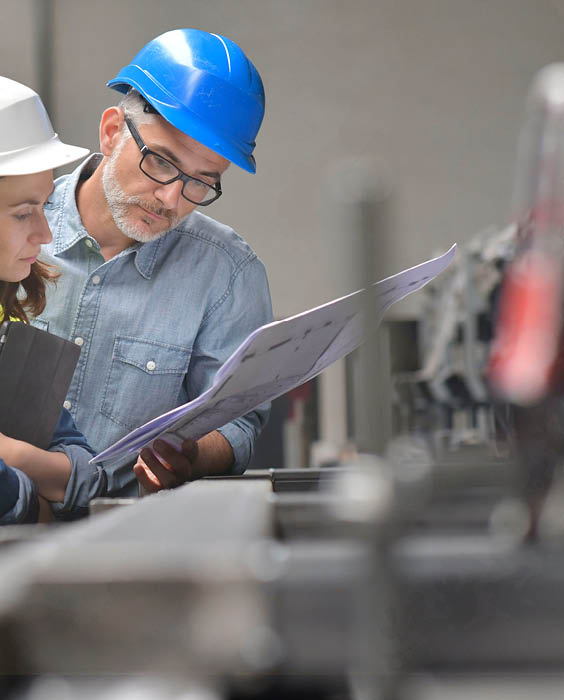 Metal industry manager and engineer meeting in factory
